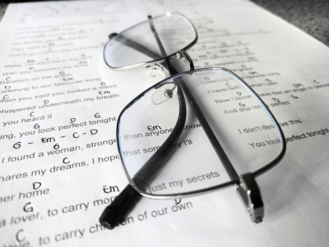 a complicated legal document with a pair of reading glasses on top