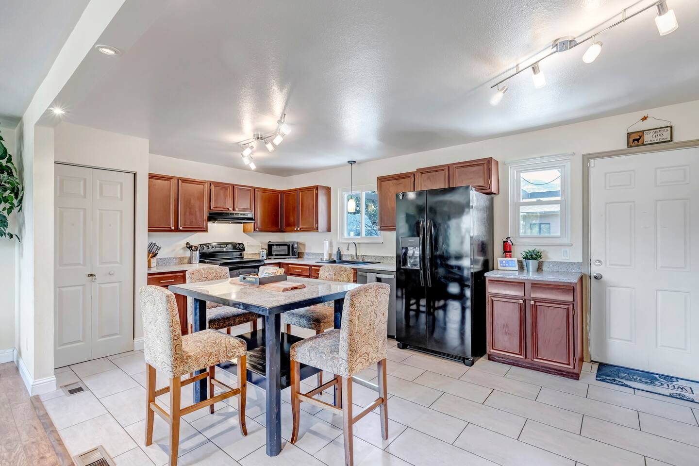 Deck with a fire pit overlooking Colorado Springs city lights at dusk