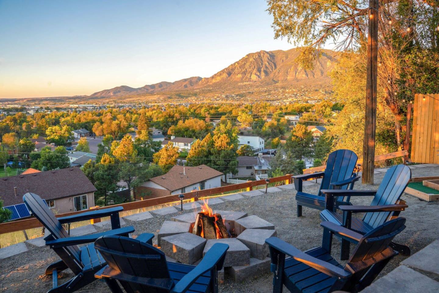Expansive deck of a vacation rental with a hot tub and incredible mountain views